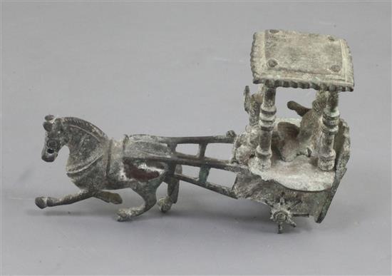 A Chinese archaic bronze model of a horse and carriage, Han dynasty, 2nd century B.C.-2nd century A.D., 12.5cm long, losses